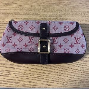 Authentic Louis Vuitton mini purse or makeup bag.